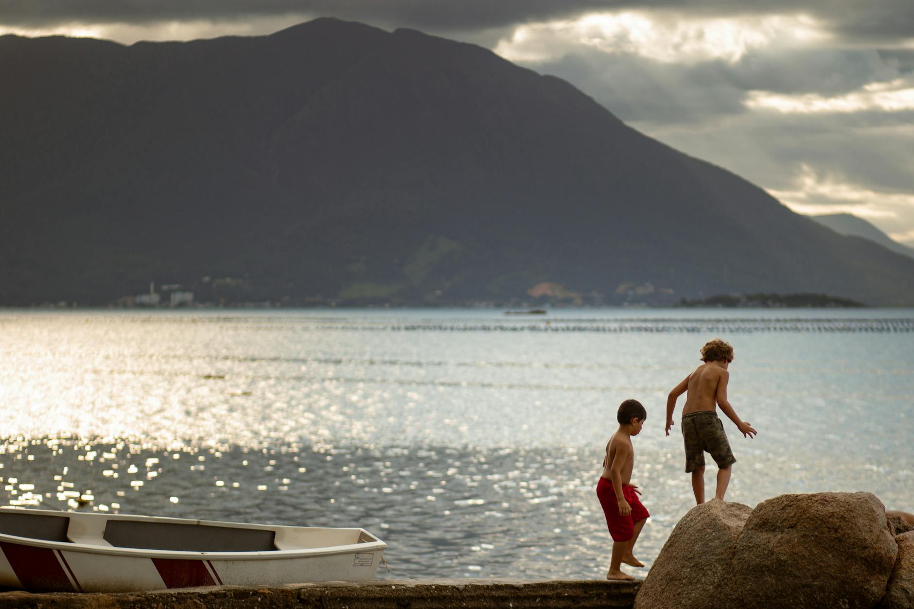 Two children having fun by the beach in Brazil during summer.