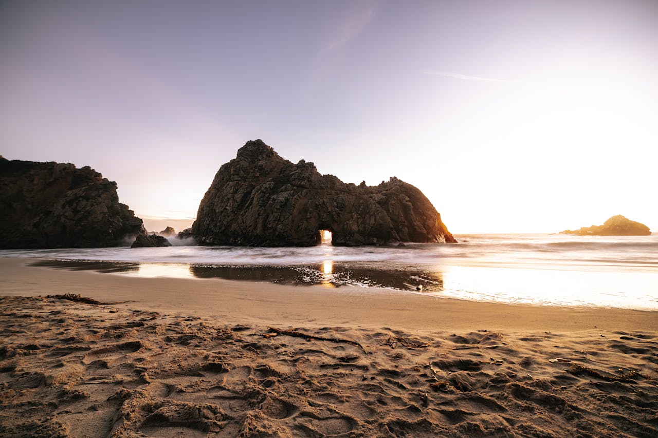 services-01 Breathtaking sunset at Pfeiffer Beach highlighting unique rock formations and serene ocean views.